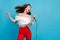 Photo of joyful happy positive woman sing karaoke wind blow hair star celebrity isolated on blue color background