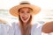 Photo of joyous blonde woman 20s in summer straw hat smiling, an