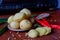 The photo is of kitchen spices in the form of potatoes, turmeric, white pepper against the background of an old radio