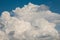 Photo of large white cumulonimbus cloud, summer thunderstorm in Guardo Tadino