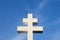 Photo of a large white double cross on a blue sky