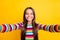 Photo of little girl make selfie look camera cheerful shiny smile wear striped shirt isolated yellow color background