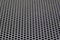 Photo of a loudspeaker grill as a background.