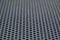 Photo of a loudspeaker grill as a background.