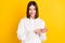 Photo of lovely cheerful lady beaming smile count fingers wear white hoodie isolated yellow color background