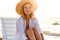 Photo of lovely european woman 20s in straw hat smiling, while s