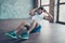 Photo of macho sportsman guy doing static sit ups sitting floor determined person sportswear tank-top shorts sneakers