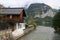 Photo of a majestic mountain overlooking a serene body of water, Austria