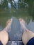 photo of a man\'s feet soaking in water