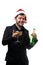 Photo of man in Santa`s cap, with caramel cane in mouth, with glass of champagne, bottle in hands .