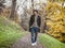 Photo of a man walking through a serene forest path