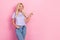 Photo of mature age woman wear striped t-shirt new denim jeans finger direct empty space cheap clothes offer isolated on
