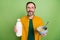 Photo of mature happy positive man hold hands milk food breakfast smile isolated on green color background