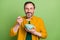 Photo of mature man happy positive smile eat cornflakes breakfast yummy isolated over green color background