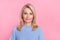 Photo of mature nice blond lady wear blue sweater isolated on pink color background