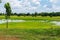 The photo of the meadow and cloudy blue sky