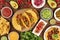 A photo of Mexican food, including tacos, guacamole, pico de gallo, nachos etc