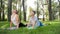 Photo of middle aged mother with her teenage boy child doing yoga and breathing exercises at park. Family taking care of