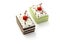 Photo Miniature fake rectangular cakes with whipped cream and cherry