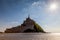 Photo of Mt St Michel in Normandy France in the afternoon with a sunstar