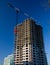 The photo of multistory building, shot on the wide lens with PL filter, in the sunset light