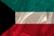 Photo of the national flag of the state of Kuwait on a luxurious texture of satin, silk with waves, folds and highlights, closeup