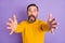 Photo of nervous scared man stretch hands camera open mouth wear yellow pullover isolated violet background