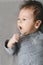 Photo of newborn baby, looking away, yawning or talking. Copy space
