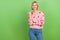 Photo of nice cheerful happy lady blonde wear pink cardigan directing finger empty space looking offer  on green