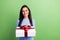 Photo of nice curious brown hair lady hold present look empty space wear blue dress isolated on green background