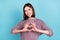 Photo of nice girlfriend lady show heart form shiny smile wear knitted pullover isolated blue color background