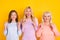 Photo of nice hooray blond red hair grand mom daughter wear pastel cloth isolated on yellow color background