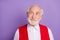 Photo of old dreamy curious grandfather look empty space wear red vest good mood isolated on purple color background
