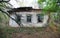 Photo of an old house. old ruined house in the village. destroyed Ukrainian hut