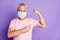 Photo of old man flex muscles point finger wear white face mask isolated purple color background