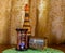 Photo of an old sandglass, bottle an casket on brown background