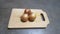 Photo of Onions On A Wooden Tray with Horizontal Angle.