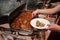 Photo of open steel Bain Marie on stand with a dish of Italian cuisine - pasta with tomato Basil and minced beef meat