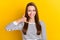 Photo of optimistic brunette millennial lady hand telephone wear white sweater isolated on yellow color background