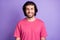 Photo of optimistic nice brunet guy wear pink t-shirt isolated on pastel violet color background