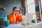 Photo of overworked burnout elderly lady wear orange pullover tired working modern device indoors apartment room