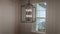 Photo Panorama Geometric chandelier hanging from the ceiling of home against window and wall