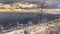 Photo Panorama Golden setting sun and dark cloudy sky over downtown Salt Lake City in winter