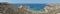 Photo panorama. Magnificent views of Riviera Beach and the small watchtower Ghajn Tuffieha Tower, Mellieha, Malta.