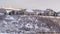 Photo Panorama Tranquil residential area on a hill top covered with fresh snow on a winter day