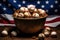 Photo of a patriotic display featuring a bowl full of baseballs in front of an American flag