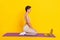 Photo of peaceful serene lady sit mat watch yoga pc lesson wear grey cropped top  yellow color background