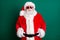 Photo of pensioner grandpa white beard smiling hands belt waiting chlidren take holiday picture wear red santa costume