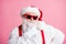 Photo pensive unsure santa claus touch hand his beard think thoughts decide best way x-mas christmas gift present