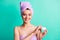 Photo of perfect tender girl hold open balm container look camera wear purple towel turban isolated teal color